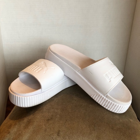 Super Cushy Puma Platform Slides in white. Super Cushy Puma Platform Slides in white.